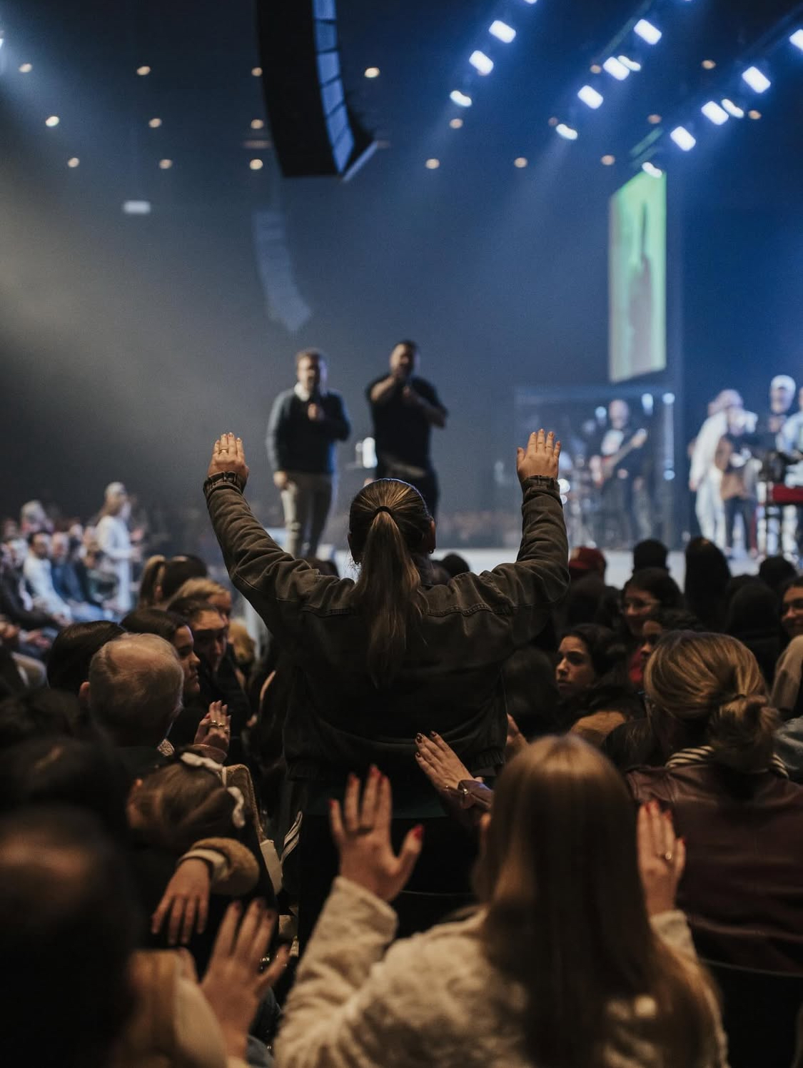 Believers gathered during a live ministry event
